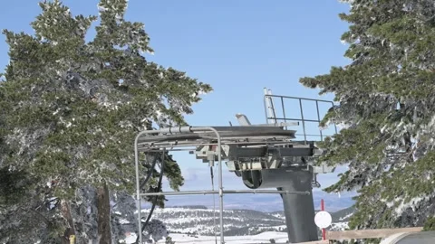 Structure of a mechanical ski lift at a snowy slope Stock Footage 301637367