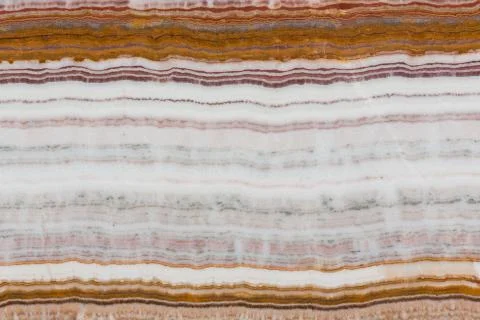Structure of the multi colored onyx stone close up. Stock Photos