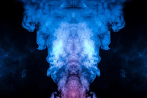 The structure of multi-colored smoke scattered on a black background and risi Stock Photos