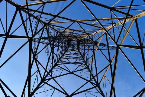 The structure of the power mast seen from the inside. Spring. Stock Photos