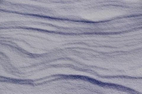 The structure of the snow surface in the obliquely falling rays of the sun Stock Photos