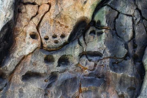 Structure of surface of the stone, used as background. Stone texture. Natural Stock Photos