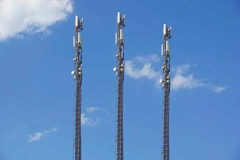 Structure tower of cell phone antenna with blue sky Stock Photos