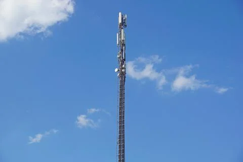 Structure tower of cell phone antenna with blue sky Stock Photos