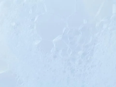 Structure of White Foam bubbles abstract texture on white background. Stock Photos