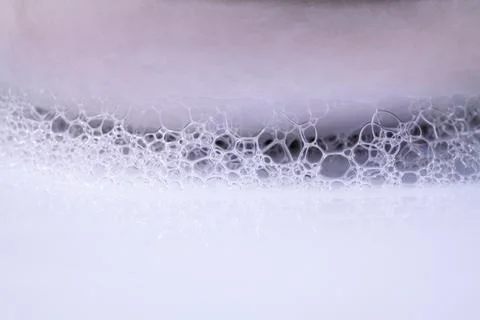 Structure of White Foam bubbles abstract texture on white background. Stock Photos