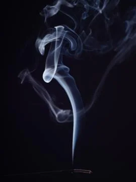 Structure of white smoke, brush effect. Burning incense isolated on black Stock Photos