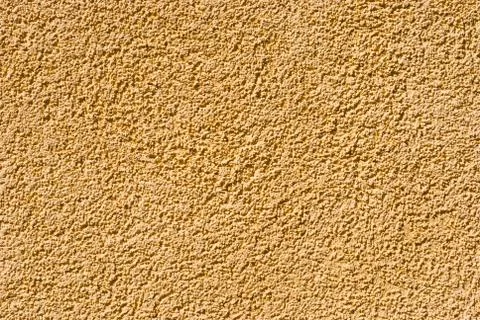 Structured plaster, orange wall texture Stock Photos