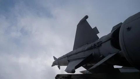 Structured scenario showing maintenance crew inspecting missile with technical Stock-Fotos