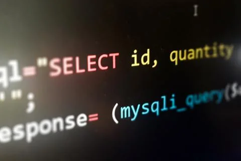Structured sql code on monitor. SQL code on a dark background development Stock Photos