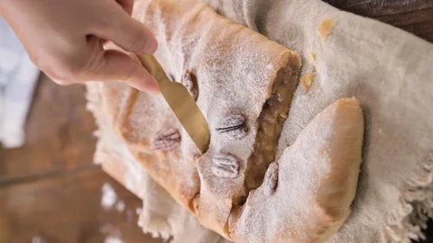 Strudel with apple. A typical sweet pastry in northern Italy, in Trento. Pie Stock Footage 218445556
