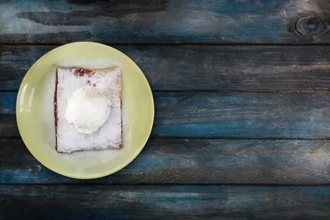 Strudel with cherry , served on the ceramic plate with the ice cream. Stock Photos