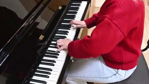 Struggle of piano learning captured as beginner perseveres through mistakes Stock Footage 305652550