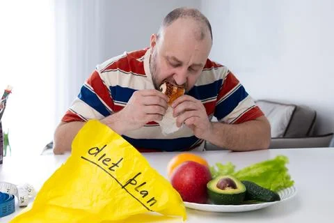 Struggles with Dieting The Ongoing Temptation vs Healthy Dietary Choices Di.. Stock Photos