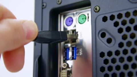 Struggling To Connect a USB Cable to the Rear Socket of a Desktop PC Stock Footage 276274295