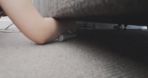 Struggling hand underneath the bed Video stock 94368413