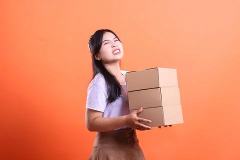 Struggling with Heavy Boxes Stock Photos
