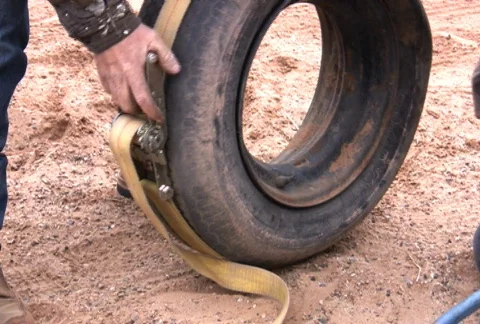 Struggling with an Old Tire Stock Footage 74640