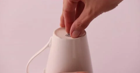 Struggling taking off a sticker 2 Stock Footage 132210684