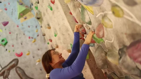 Struggling on training wall Stock Footage 339287821