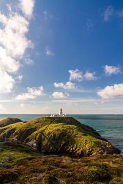 Strumble Head and Lighthouse on the west welsh coast. Copyspace above. Stock Photos
