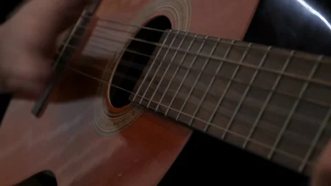 Strumming acoustic guitar Stock Footage