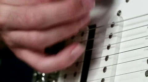 Strumming an Electric Guitar Stock Footage 25395978