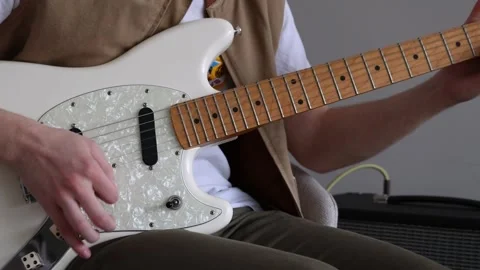 Strumming an electric guitar Stock Footage 333462762