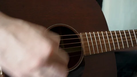 Strumming on guitar - 4k- Video stock 112606240