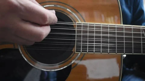 Strumming a Guitar in Real Time Stock Footage 301738384