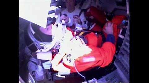STS-125 mission Pilot Greg Johnson assisted into seat on Space Shuttle Atlantis Stock Footage 283460461