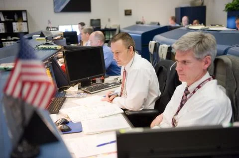 STS-130 ascent flight controllers on console in WFCR with Flight Director N.. Stock Photos