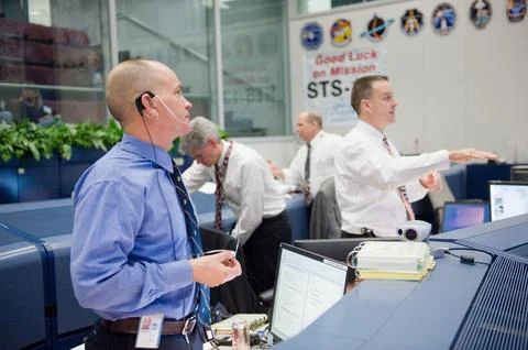 STS-130 ascent flight controllers on console in WFCR with Flight Director N.. Stock Photos