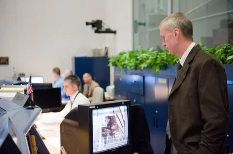 STS-130 ascent flight controllers on console in WFCR with Flight Director N.. Stock Photos