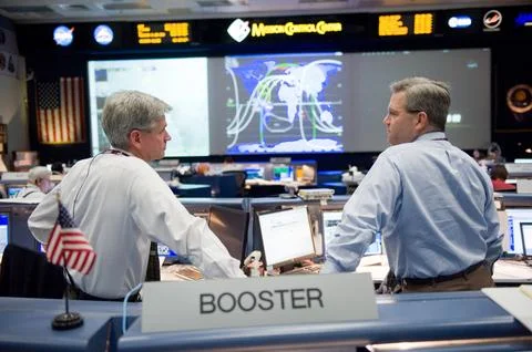 STS-130 ascent flight controllers on console in WFCR with Flight Director N.. Stock Photos