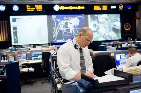 STS-130 ascent flight controllers on console in WFCR with Flight Director N.. Stock Photos