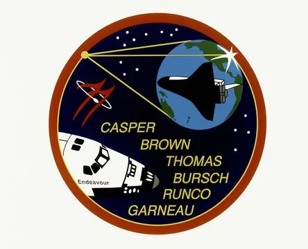 The STS-77 crew patch displays the Shuttle Endeavour in the lower left and... Stock Photos
