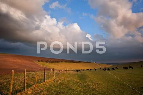 Sttunning scene across escarpment countryside landscape with beautiful clouds Stock Photos