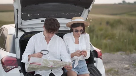 Stubborn man refusing help with directions from beautiful girlfriend Stock Footage 113925660