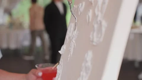 Stucco is applied to the canvas to create a painting Video stock 329095128