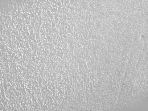 Stucco relief grey wall image. Relief texture Stock Photos