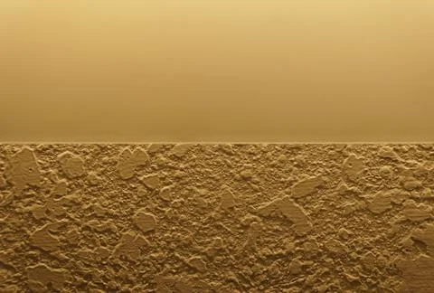 Stucco surface with rough texture contrasts against smooth yellow gradient,.. Stock Photos