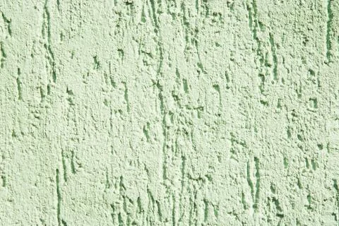 Stucco texture, rough ragged plaster background, scratched cracked wall Stock Photos
