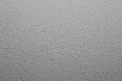 Stucco wall showing rough texture and bumpy surface 스톡 사진