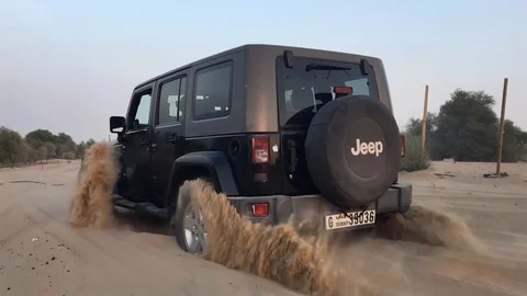 Stuck Car in the Desert Captured in Slow Motion Stock Footage 99696186