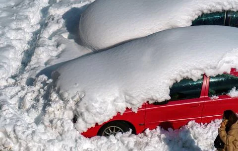 Stuck in the snow and calling on the cell phone Stock Photos