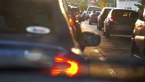 Stuck in traffic jam on the streets of California at sunset in slow motion 25 Video stock 167090953