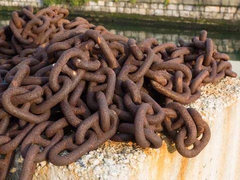 Stud link rusted chain used for mooring or anchoring Stock Photos