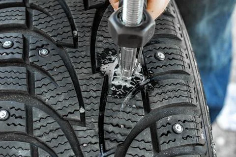 Stud replacement prevents reduced traction and uneven wear Stock Photos
