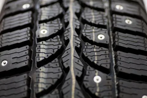 Studded tire on a background close-up Stock Photos